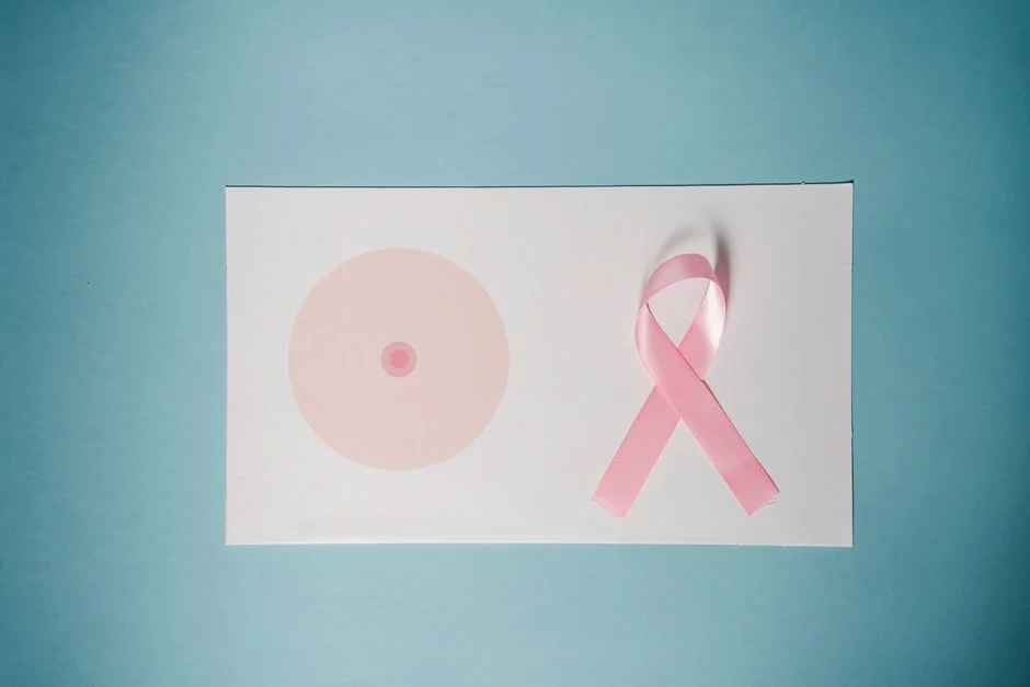 Comprehensive Cancer Screening in Junagadh – Early Detection Saves Lives Breast cancer awareness concept with pink ribbon on pastel background.